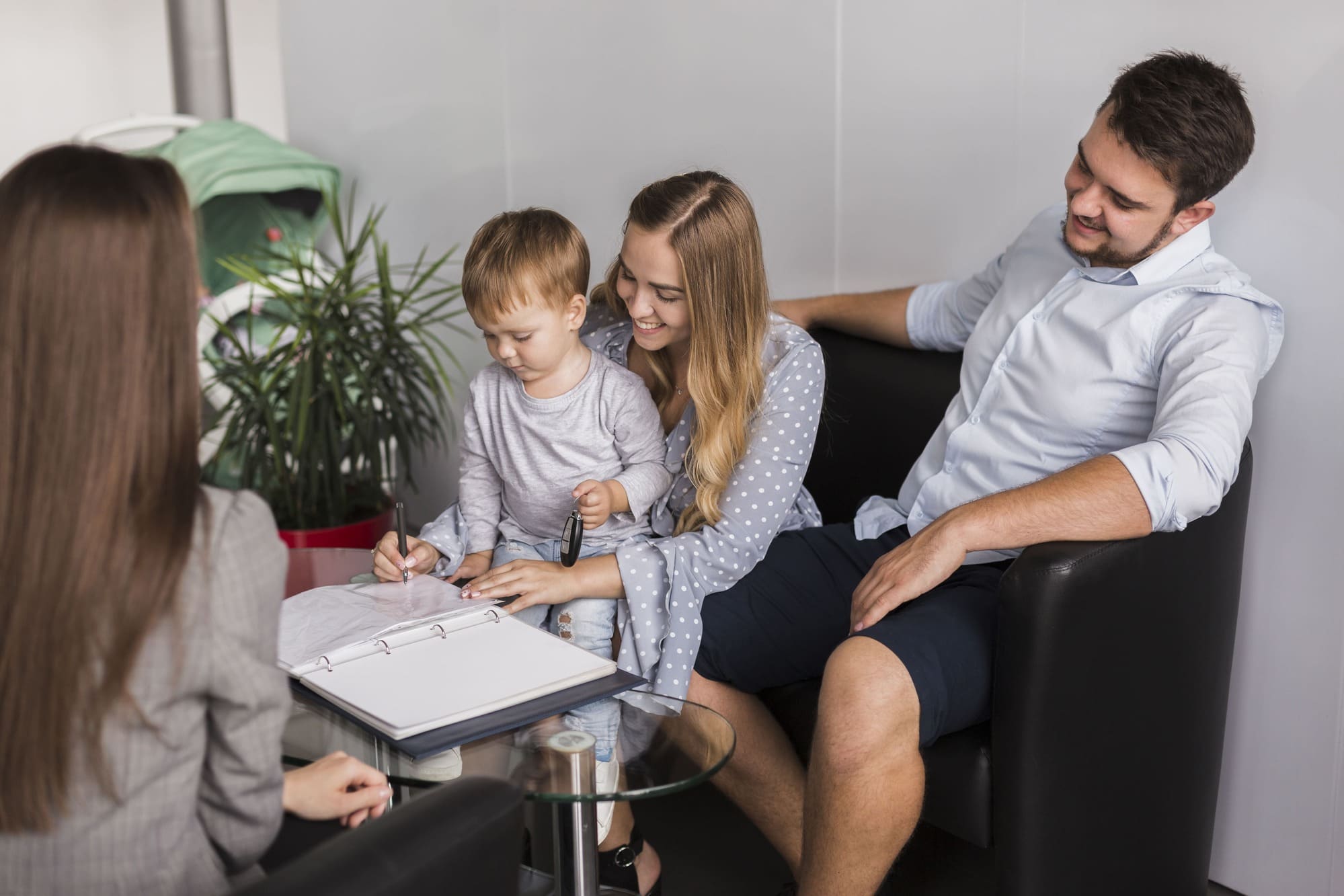 Family gathered around a table looking at their Estate Plan from Wills & Trust